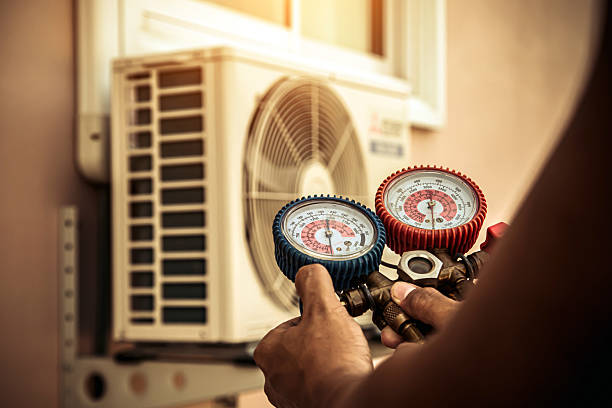Professional Air Conditioning Service technician working in Toms Brook, VA